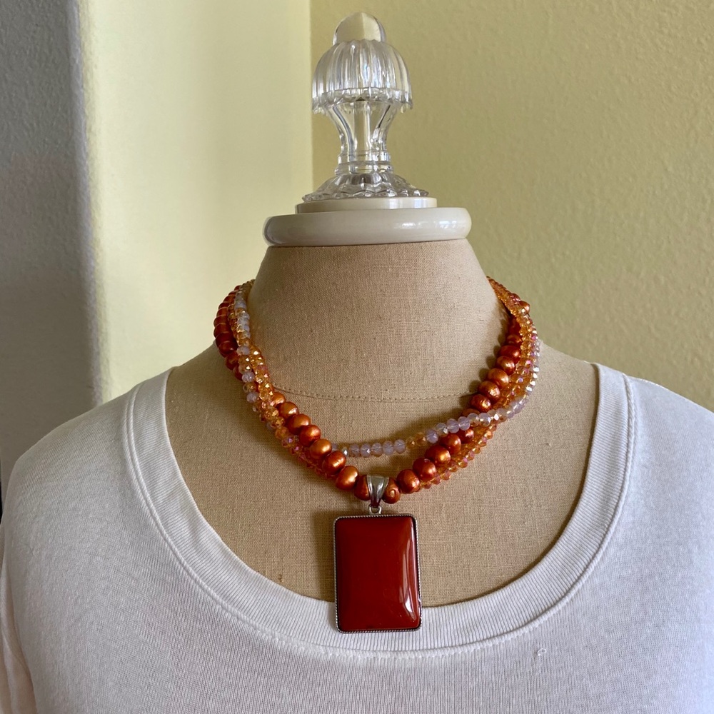 Stunning necklace with pumpkin colored stone
